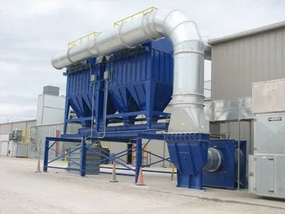 Large industrial dust collector system outside a building